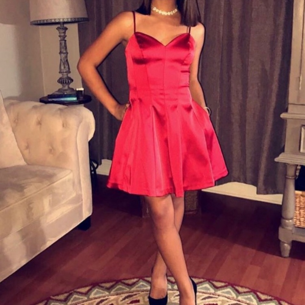 Beautiful Red dress with pockets and adjustable straps.